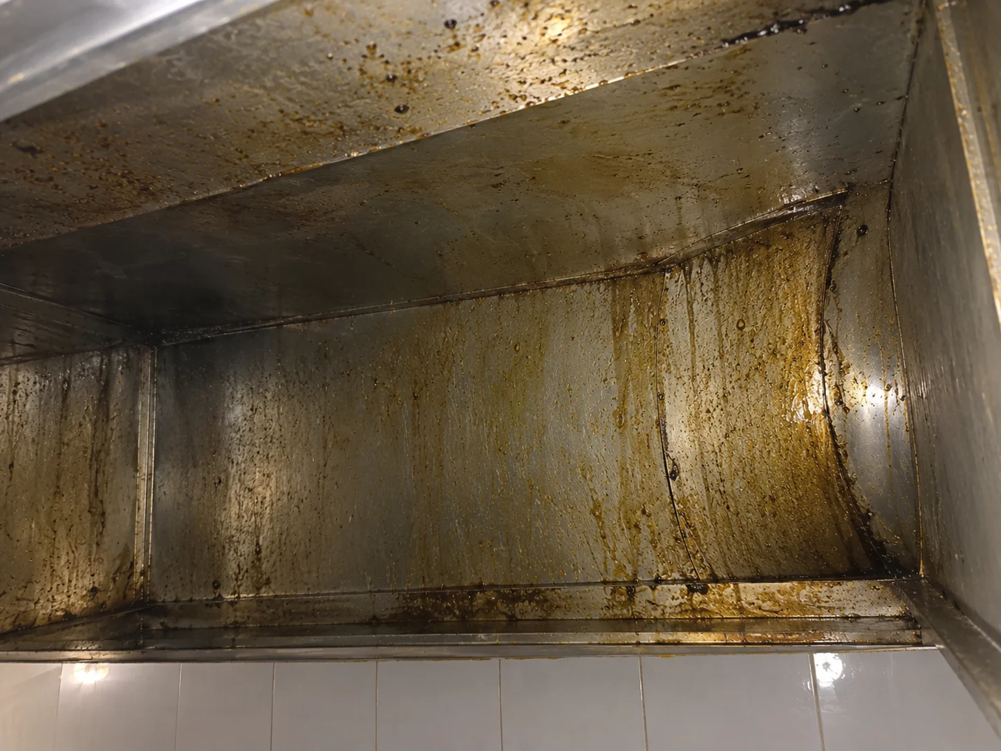 Industrial metal ventilation ductwork running through a commercial building